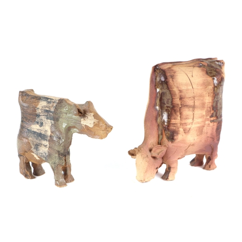 374 - A Karen Laver studio pottery cow, 18cm high and another similar, 14cm high (2).