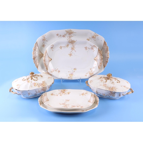 389 - A Limoges dinner service with floral and gilt decoration comprising tureens and covers, meat platter... 