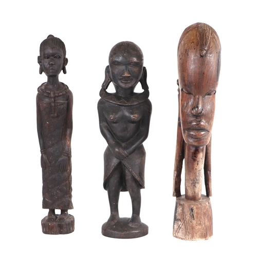 420 - An African carved hardwood fertility figure, 40cm high; two others similar and an Ashanti style stoo... 