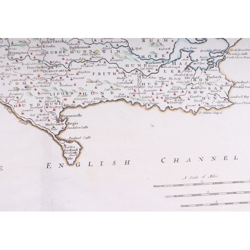 44 - John Speed - a hand coloured map of Dorsetshyre with armorials and vignette of Dorchester, 57 by 43c... 