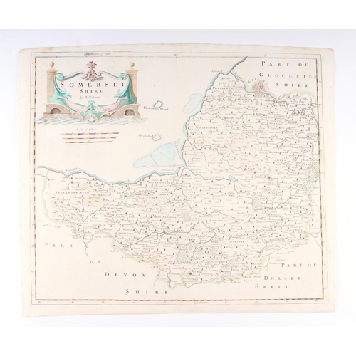 44 - John Speed - a hand coloured map of Dorsetshyre with armorials and vignette of Dorchester, 57 by 43c... 