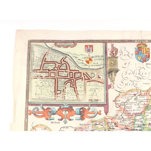 44 - John Speed - a hand coloured map of Dorsetshyre with armorials and vignette of Dorchester, 57 by 43c... 