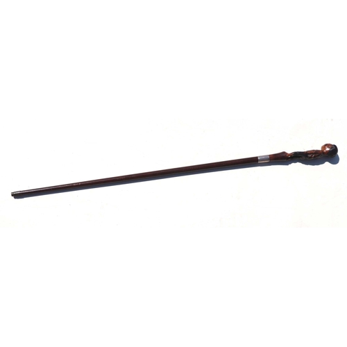 458 - A 19th century mahogany walking stick with figural handle depicting a young boy wearing ragged cloth... 