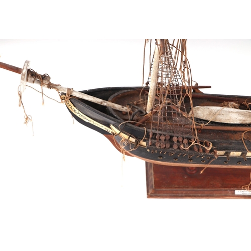 477 - A model of a three-masted ship, 'US Constitution', mounted on a stand, 61cms long.