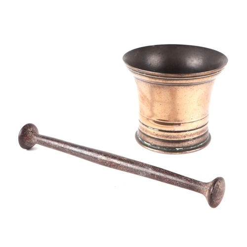 520 - An 18th century bronze pestle and mortar, 12cms high; together with a hand bell with turned wooden h... 