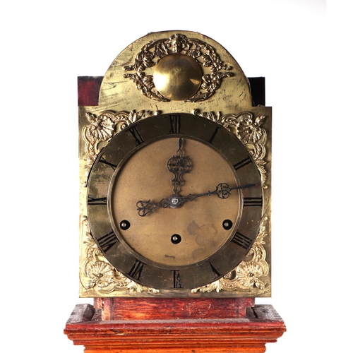 582 - A dwarf long case clock, the arched brass dial with roman numerals fitted a walnut case, 178cm high.