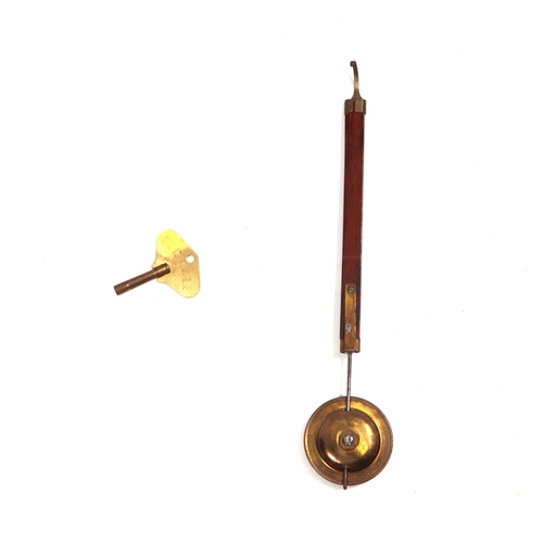 582 - A dwarf long case clock, the arched brass dial with roman numerals fitted a walnut case, 178cm high.