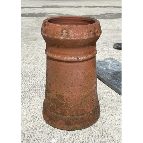 6 - Two terracotta chimney pots, the largest 61cms high; together with various pieces of slate and stone... 