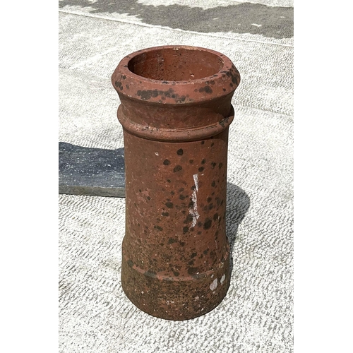 6 - Two terracotta chimney pots, the largest 61cms high; together with various pieces of slate and stone... 