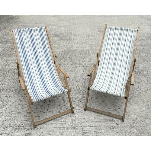 7 - A pair of traditional canvas deck chairs.