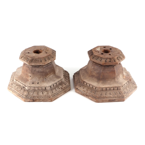 8 - A pair of carved hardwood column capitals of octagonal from, 33cm wide.