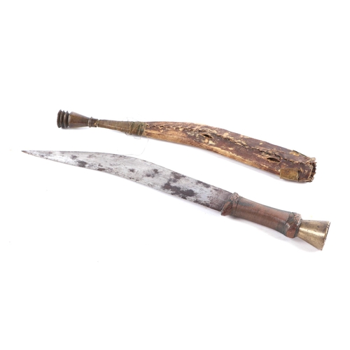 80 - A North African dagger with copper wire bound grip and leather scabbard, 49cm long.