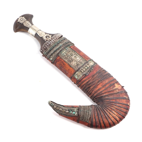 81 - A Middle Eastern Jambiya dagger with leather scabbard, 34cm long.