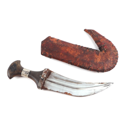 81 - A Middle Eastern Jambiya dagger with leather scabbard, 34cm long.