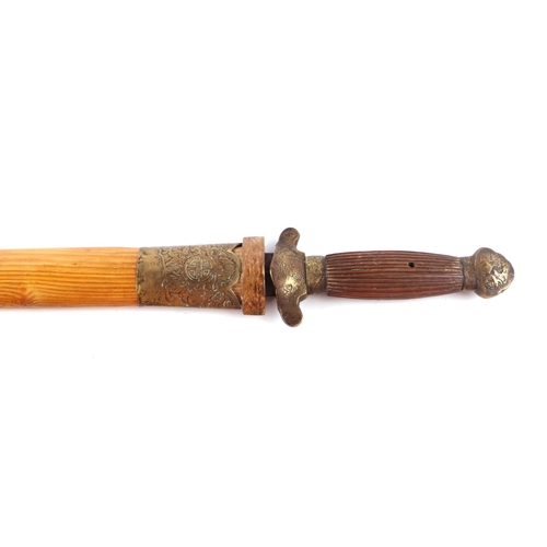 82 - A Chinese short sword with hardwood grip and brass mounts, 61cm long.