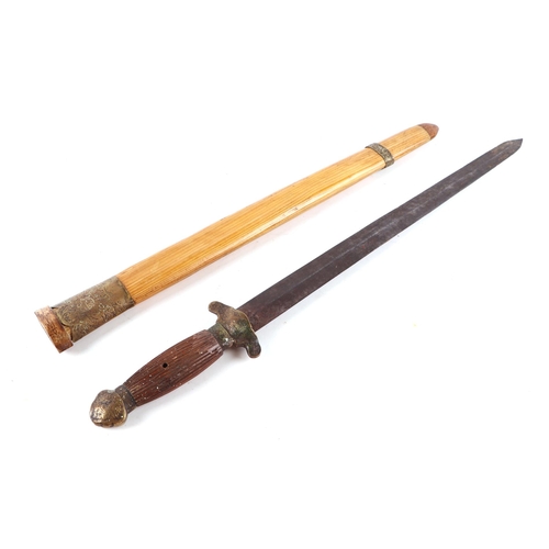 82 - A Chinese short sword with hardwood grip and brass mounts, 61cm long.