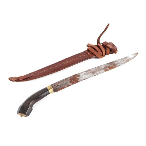 83 - A South American machete with hardwood handle and leather scabbard, 64cm long.