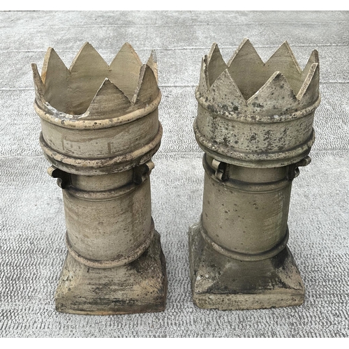 9 - A pair of crown top earthenware chimney pots, each 80cm high (2).