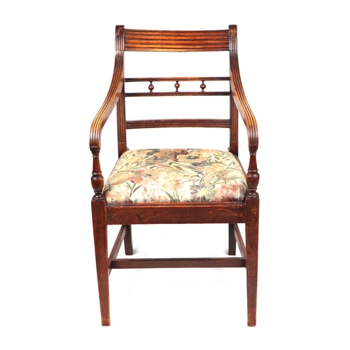 957 - An inlaid mahogany Regency desk chair with square tapering reeded legs; together with another simila... 