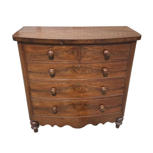 959 - A Victorian figured mahogany bowfront chest of two short and three graduated long drawers, on turned... 