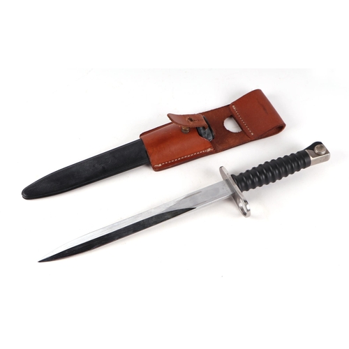 96 - A Swiss M1957 Schmidt Rubin bayonet for the STGW 57, in its scabbard with leather frog. Makers mark ... 