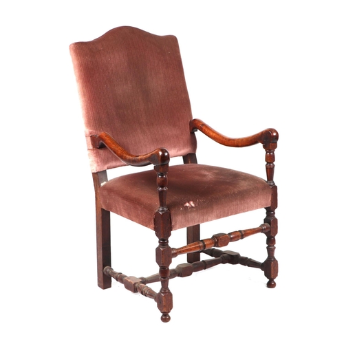 963 - A 19th Century oak elbow chair with upholstered seat and back.