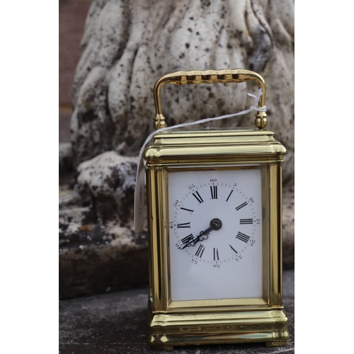 578 - A carriage clock, the white enamel dial with Roman and Arabic numerals, with blued steel hands, fitt... 