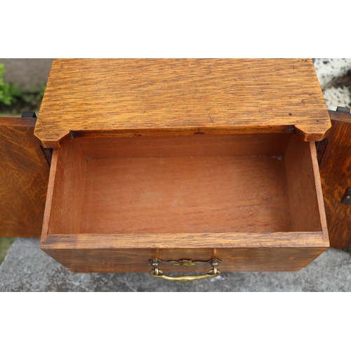 451 - A late Victorian / early Edwardian oak table to safe box, having twin doors opening to reveal three ... 