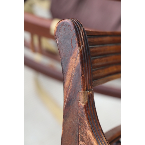 957 - An inlaid mahogany Regency desk chair with square tapering reeded legs; together with another simila... 