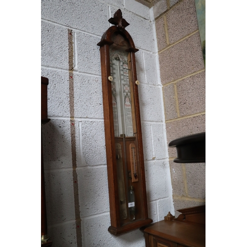 434 - A Victorian Admiral Fitzroy barometer in an oak case. 112cm high