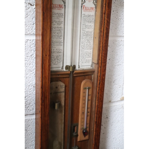 434 - A Victorian Admiral Fitzroy barometer in an oak case. 112cm high