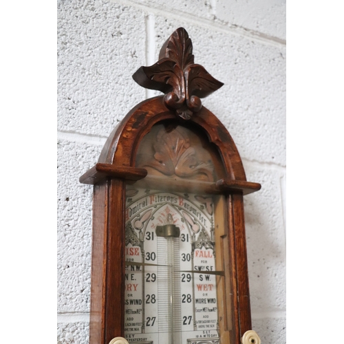 434 - A Victorian Admiral Fitzroy barometer in an oak case. 112cm high