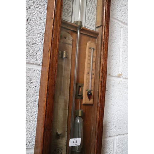 434 - A Victorian Admiral Fitzroy barometer in an oak case. 112cm high