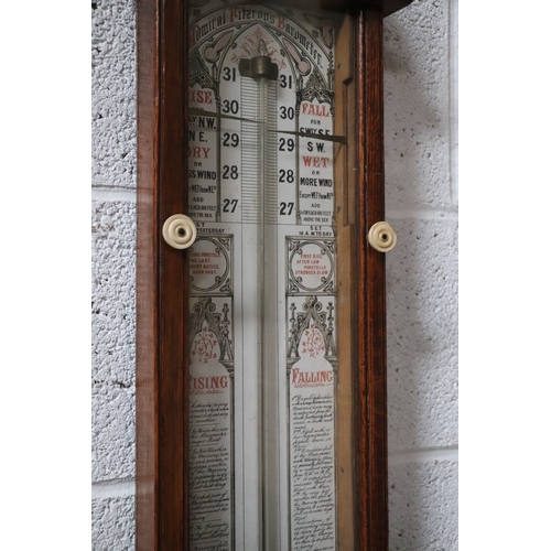 434 - A Victorian Admiral Fitzroy barometer in an oak case. 112cm high