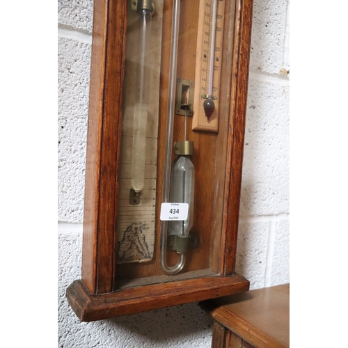 434 - A Victorian Admiral Fitzroy barometer in an oak case. 112cm high