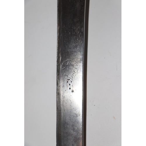 136 - An Indian Tulwar sword and leather scabbard, with white metal inlaid handle, 90cm long.