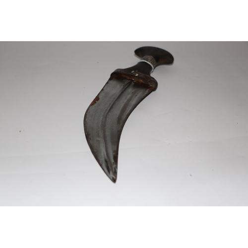 81 - A Middle Eastern Jambiya dagger with leather scabbard, 34cm long.