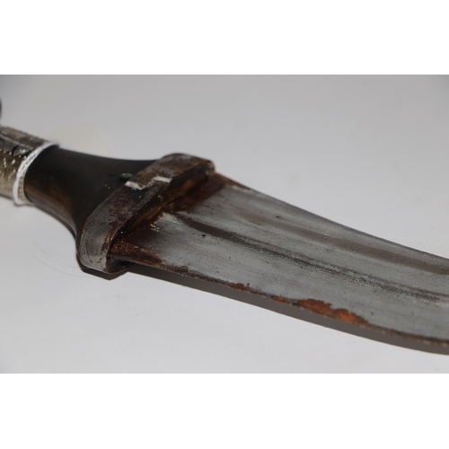 81 - A Middle Eastern Jambiya dagger with leather scabbard, 34cm long.