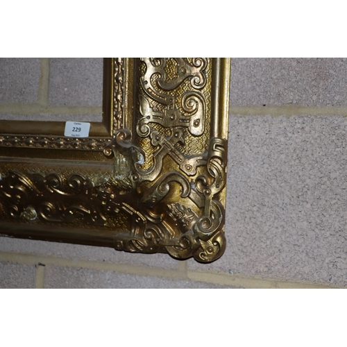 229 - A large 19th century gilt wood and gesso picture frame, overall 83cm by 96cm (to hold painting 58cm ... 