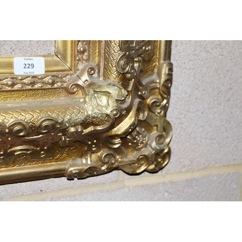 229 - A large 19th century gilt wood and gesso picture frame, overall 83cm by 96cm (to hold painting 58cm ... 