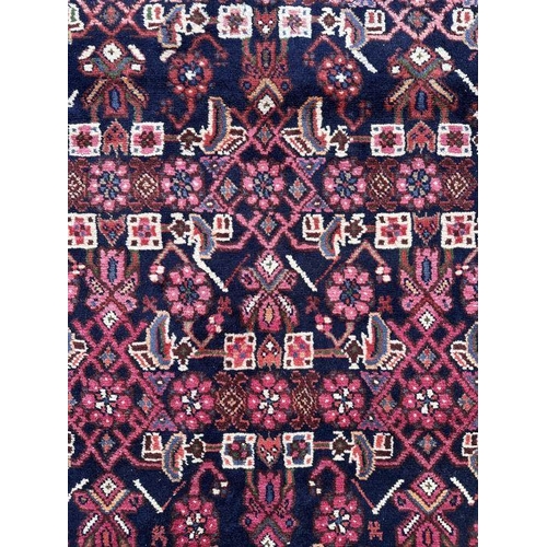 121 - A fine quality Persian Hamadan woollen hand knotted runner with repeating stylised floral design wit... 