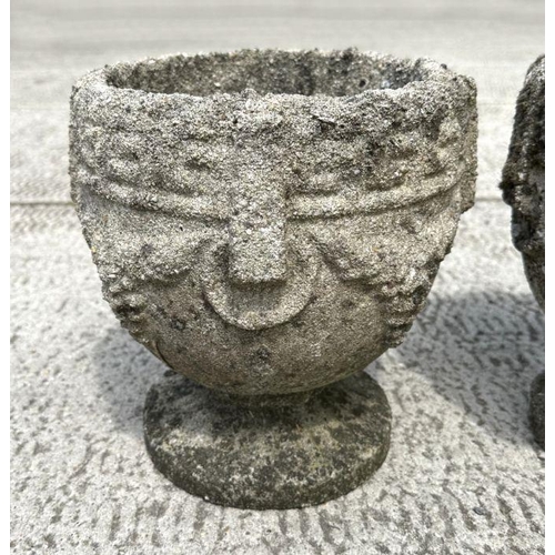 14 - A set of four well weathered reconstituted stone urn form planters, 23cm diameter, (4)