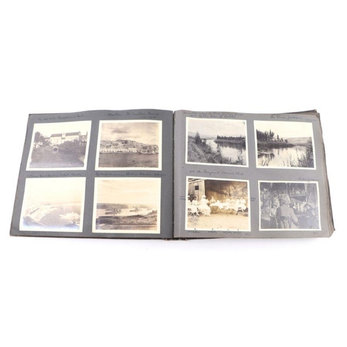 20 - An early 20th century photo album containing World Tour and Military photos; together with a postcar... 