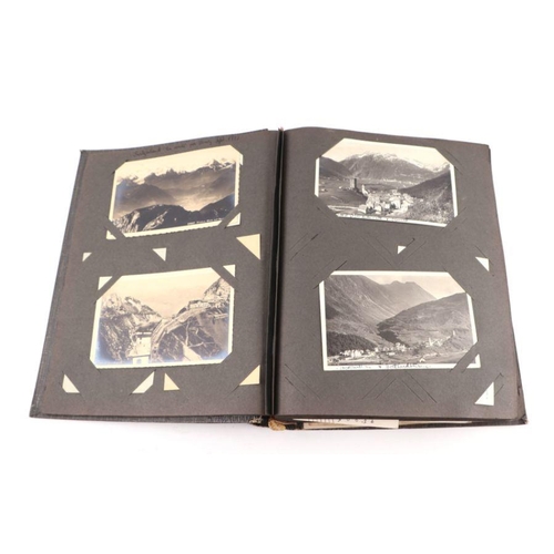 20 - An early 20th century photo album containing World Tour and Military photos; together with a postcar... 