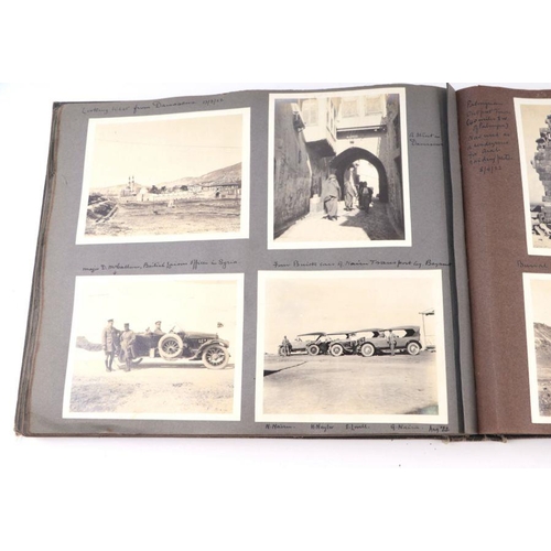 20 - An early 20th century photo album containing World Tour and Military photos; together with a postcar... 