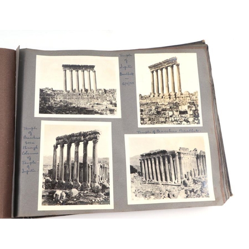 20 - An early 20th century photo album containing World Tour and Military photos; together with a postcar... 