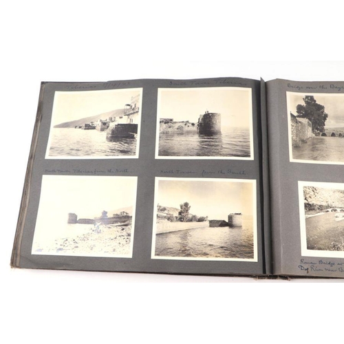 20 - An early 20th century photo album containing World Tour and Military photos; together with a postcar... 