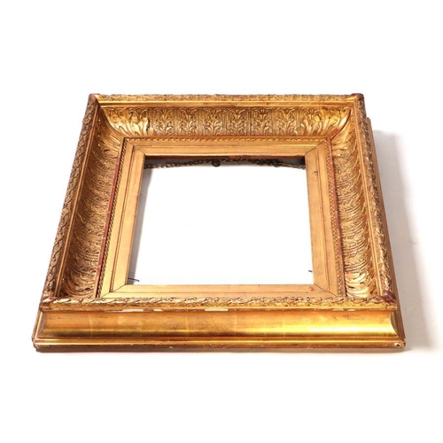 235 - A 19th century giltwood and gesso picture frame, overall 62 by 70cms, to hold a painting 42 by 36cms... 