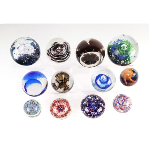 252 - A collection of glass paperweights to include Selkirk and Caithness.