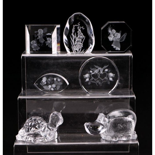 253 - A collection of glass paperweights to include Caithness, Murano and Selkirk.